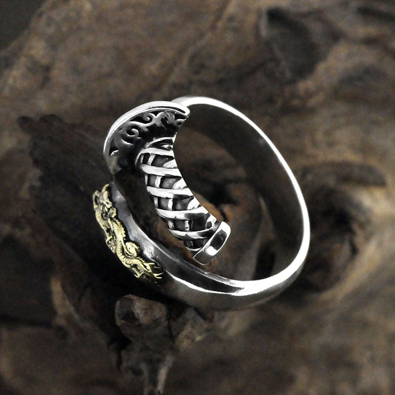 Silver ring with intricate design on a textured surface, make it on the white background
