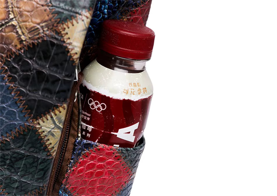 Multi-color Leather Backpack with Embossed Patterns on Patchwork Design