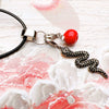 Black Crystal Snake and Red Apple Pendant with Rope Necklace
